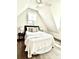 Bright bedroom featuring a window, wood floors, and a sloped ceiling at 25 Nats Ct, Charleston, SC 29403