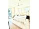 Bright bedroom featuring a ceiling fan, hardwood floors, and a sliding glass door to the outside at 25 Nats Ct, Charleston, SC 29403