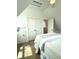 Bright bedroom featuring white walls, closet, and hardwood floors, creating a clean and modern space at 25 Nats Ct, Charleston, SC 29403