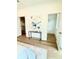 Bright hallway featuring wood floors and an abstract painting at 25 Nats Ct, Charleston, SC 29403