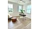 Bright office space with desk, chair, and ample natural light from multiple windows at 25 Nats Ct, Charleston, SC 29403