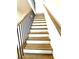 Staircase featuring wood steps and black railings at 25 Nats Ct, Charleston, SC 29403