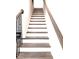 View of the staircase with wooden treads and black iron railing at 25 Nats Ct, Charleston, SC 29403