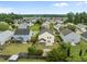 An aerial view of a residential neighborhood featuring well-maintained lawns, mature trees, and various home styles at 251 Emerald Isle Dr, Moncks Corner, SC 29461