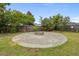 Backyard fire pit area featuring a circular patio at 251 Emerald Isle Dr, Moncks Corner, SC 29461