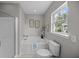 Bright bathroom features a soaking tub with shower, and a window providing natural light at 251 Emerald Isle Dr, Moncks Corner, SC 29461