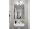 Cozy powder room featuring stylish pedestal sink, neutral colors, and decor at 251 Emerald Isle Dr, Moncks Corner, SC 29461