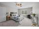 Comfortable bedroom with neutral colors, plush carpeting, and abundant natural light at 251 Emerald Isle Dr, Moncks Corner, SC 29461