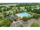 A large community pool surrounded by palm trees, lounge chairs, and a clubhouse with ample parking at 251 Emerald Isle Dr, Moncks Corner, SC 29461