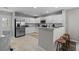 Bright kitchen featuring stainless appliances, ample countertop space, and a breakfast bar with seating at 251 Emerald Isle Dr, Moncks Corner, SC 29461