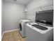 Laundry room featuring modern washer and dryer with shelving unit at 251 Emerald Isle Dr, Moncks Corner, SC 29461