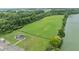 Aerial view of a park featuring a gazebo, parking area, open green space, and lake access at 251 Emerald Isle Dr, Moncks Corner, SC 29461