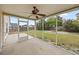 Back screened porch with fan overlooking the lawn and backyard at 251 Emerald Isle Dr, Moncks Corner, SC 29461