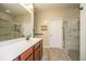 Bright bathroom featuring double sinks, walk-in shower, and natural light at 254 Mayfield Dr, Goose Creek, SC 29445