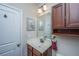 Bright bathroom features a marble countertop, a white ceramic sink, and a mirrored cabinet at 254 Mayfield Dr, Goose Creek, SC 29445