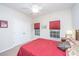 Bright bedroom with closet, windows with red coverings, and neutral colored carpet at 254 Mayfield Dr, Goose Creek, SC 29445