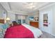 Spacious bedroom with tray ceiling, ceiling fan, and en suite bathroom at 254 Mayfield Dr, Goose Creek, SC 29445
