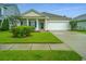 Inviting single-story home with a neatly landscaped front yard and a convenient attached one car garage at 254 Mayfield Dr, Goose Creek, SC 29445