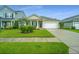 Inviting single-story home with a neatly landscaped front yard and a convenient attached one car garage at 254 Mayfield Dr, Goose Creek, SC 29445