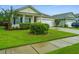 A quaint single-story house with well-maintained landscaping and a one-car garage, providing a warm and welcoming appeal at 254 Mayfield Dr, Goose Creek, SC 29445