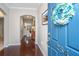 Inviting foyer with hardwood floors and a glimpse into the living area, creating a warm and welcoming entrance at 254 Mayfield Dr, Goose Creek, SC 29445