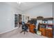 Well-lit home office with ample workspace and a view into another room at 254 Mayfield Dr, Goose Creek, SC 29445