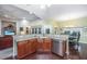 Modern kitchen with granite counters, stainless steel appliances, and a view into the living room at 254 Mayfield Dr, Goose Creek, SC 29445