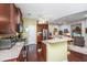 Open kitchen with granite counters, stainless appliances, and wood cabinets at 254 Mayfield Dr, Goose Creek, SC 29445