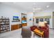 Spacious living room featuring carpeted floors, a ceiling fan, and ample seating, perfect for relaxing and entertaining at 254 Mayfield Dr, Goose Creek, SC 29445