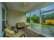 Relaxing screened-in patio with outdoor seating and ceiling fan, perfect for enjoying the outdoors at 254 Mayfield Dr, Goose Creek, SC 29445