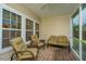 Cozy screened-in patio with comfortable seating, offering a relaxing outdoor space to unwind at 254 Mayfield Dr, Goose Creek, SC 29445