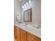Bathroom vanity with wood cabinets, white marble countertop, and classic silver fixtures at 2701 Fountainhead Way, Mount Pleasant, SC 29466