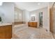 Bright bathroom featuring a soaking tub, double vanity, walk-in shower, and walk-in closet at 2701 Fountainhead Way, Mount Pleasant, SC 29466
