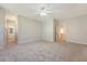 Bedroom boasts plush carpet and a ceiling fan, leading to an en-suite bathroom and hallway at 2701 Fountainhead Way, Mount Pleasant, SC 29466