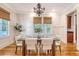 Elegant dining room with natural light, stylish chandelier, and seating for six at 2701 Fountainhead Way, Mount Pleasant, SC 29466