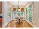 Bright dining area with a round table, French doors, and natural light at 2701 Fountainhead Way, Mount Pleasant, SC 29466
