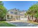 Charming two-story home with a large front yard, two-car garage and inviting front porch at 2701 Fountainhead Way, Mount Pleasant, SC 29466