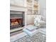 Fireplace and decorative center table of living room with a view of built-in shelves at 2701 Fountainhead Way, Mount Pleasant, SC 29466