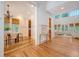 Open-concept living space featuring beautiful hardwood floors, high ceilings, and an elegant dining area at 2701 Fountainhead Way, Mount Pleasant, SC 29466