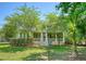 Charming home with a porch, mature landscaping, and a well-maintained front lawn at 2701 Fountainhead Way, Mount Pleasant, SC 29466