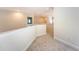 Upstairs hallway with neutral paint, carpet and views to other rooms at 2701 Fountainhead Way, Mount Pleasant, SC 29466