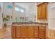 Kitchen island features cooktop, granite countertops, and custom wood cabinetry at 2701 Fountainhead Way, Mount Pleasant, SC 29466