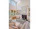 Bright living room with high ceilings, a fireplace, and built-in bookshelves at 2701 Fountainhead Way, Mount Pleasant, SC 29466