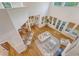 Open-concept living room with wood floors, high ceilings, large windows, and access to kitchen at 2701 Fountainhead Way, Mount Pleasant, SC 29466