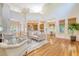 Bright living room with hardwood floors, high ceilings, and comfortable, neutral-toned furniture at 2701 Fountainhead Way, Mount Pleasant, SC 29466