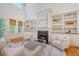 Open-concept living room with fireplace, built-ins, ample light, and stylish decor at 2701 Fountainhead Way, Mount Pleasant, SC 29466
