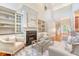 Elegant living room featuring a fireplace, built-in shelving, and staircase access at 2701 Fountainhead Way, Mount Pleasant, SC 29466