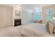 Tranquil primary bedroom features a fireplace and French doors at 2701 Fountainhead Way, Mount Pleasant, SC 29466