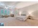 Spacious primary bedroom features tray ceilings and a seating area at 2701 Fountainhead Way, Mount Pleasant, SC 29466