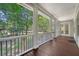 Inviting covered porch overlooking the yard and green trees for privacy and shade at 2701 Fountainhead Way, Mount Pleasant, SC 29466